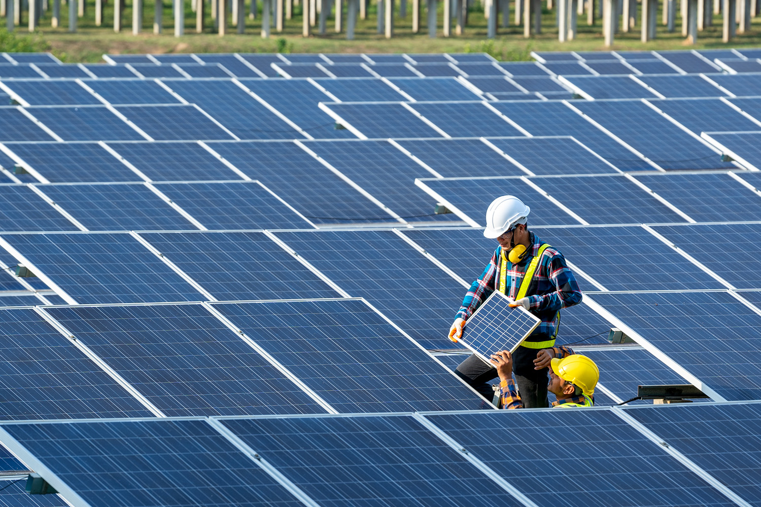 Two workers installing solar panels in Florida